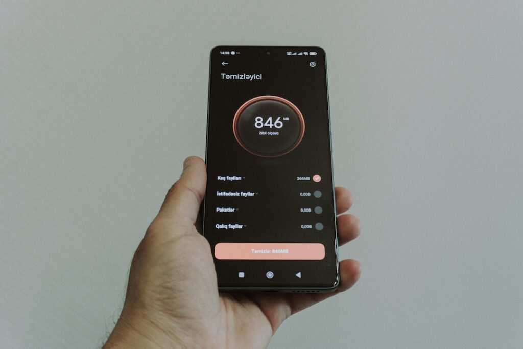 a hand holding a phone