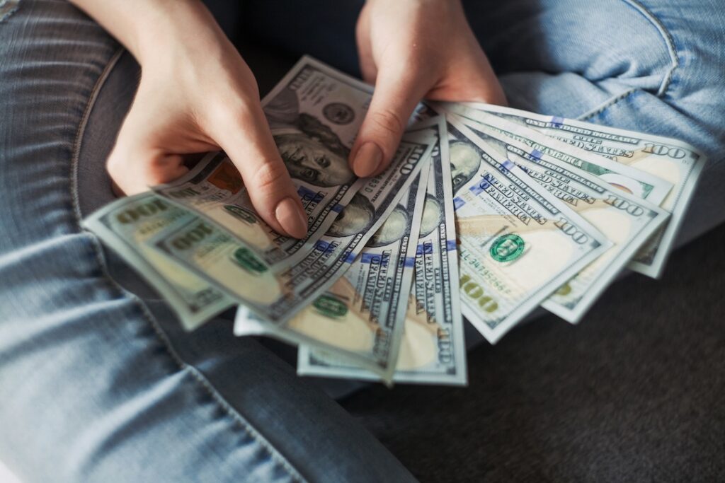 people holding money image